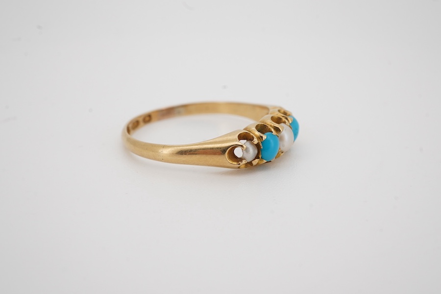 A Victorian 18ct gold, three stone split pearl and two stone turquoise set half hoop ring, size O/P, gross weight 2.5 grams.